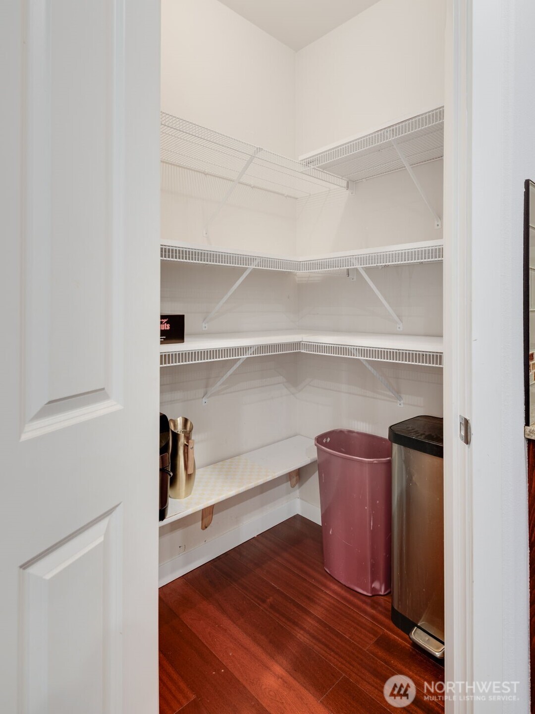 17026 Southeast 263rd Street Covington, WA 98042 - Photo 14 of 40 a room with a closet and wooden floor