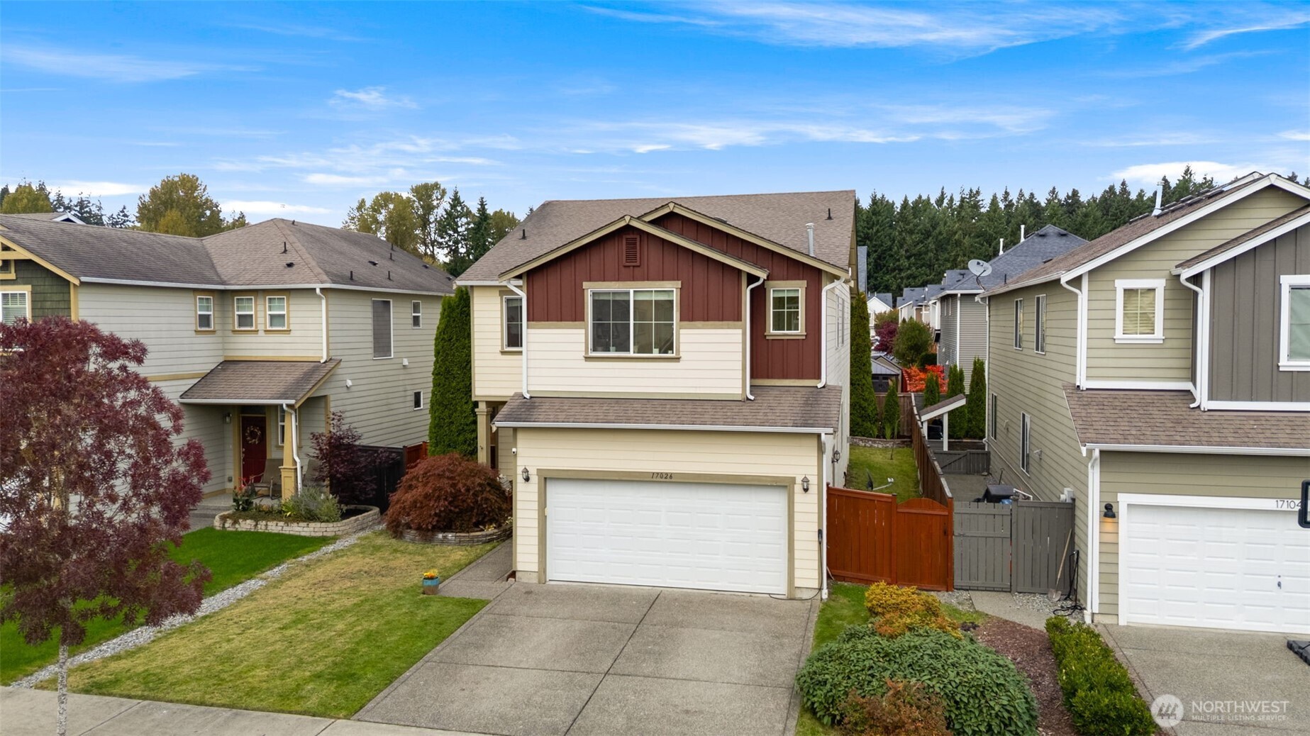 17026 Southeast 263rd Street Covington, WA 98042 - Photo 2 of 40 a front view of a house with a yard