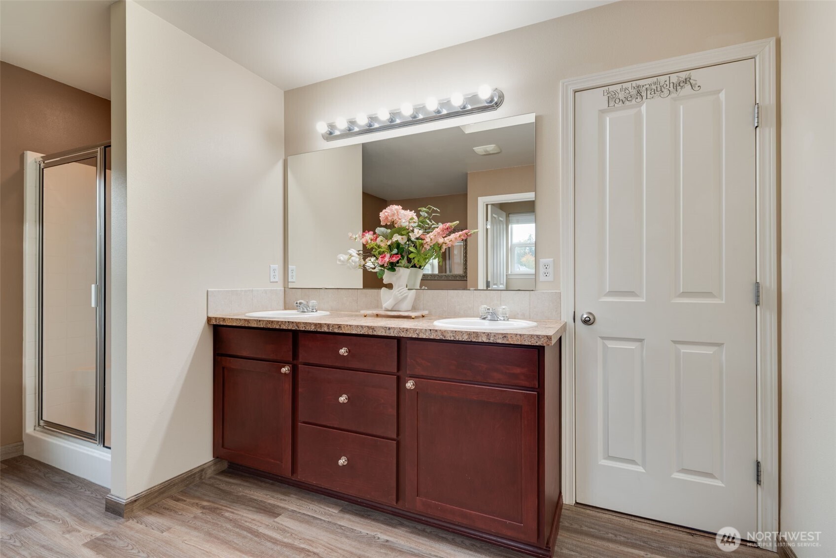 17026 Southeast 263rd Street Covington, WA 98042 - Photo 21 of 40 a bathroom with a double vanity sink and a mirror