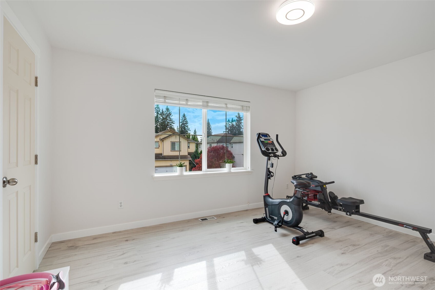 17026 Southeast 263rd Street Covington, WA 98042 - Photo 29 of 40 a view of room with gym equipment and windows