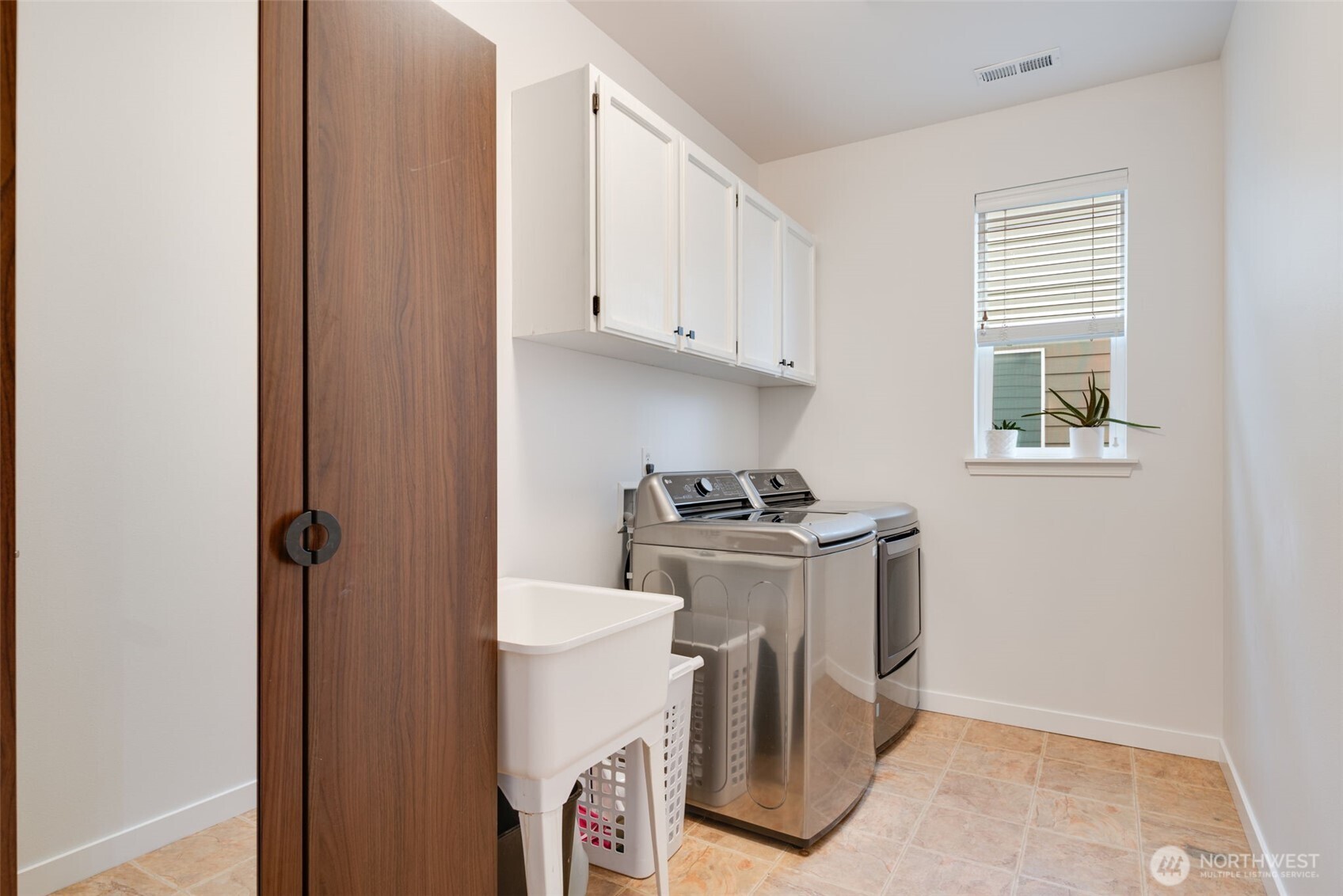 17026 Southeast 263rd Street Covington, WA 98042 - Photo 33 of 40 a view of storage and utility room with washer and dryer