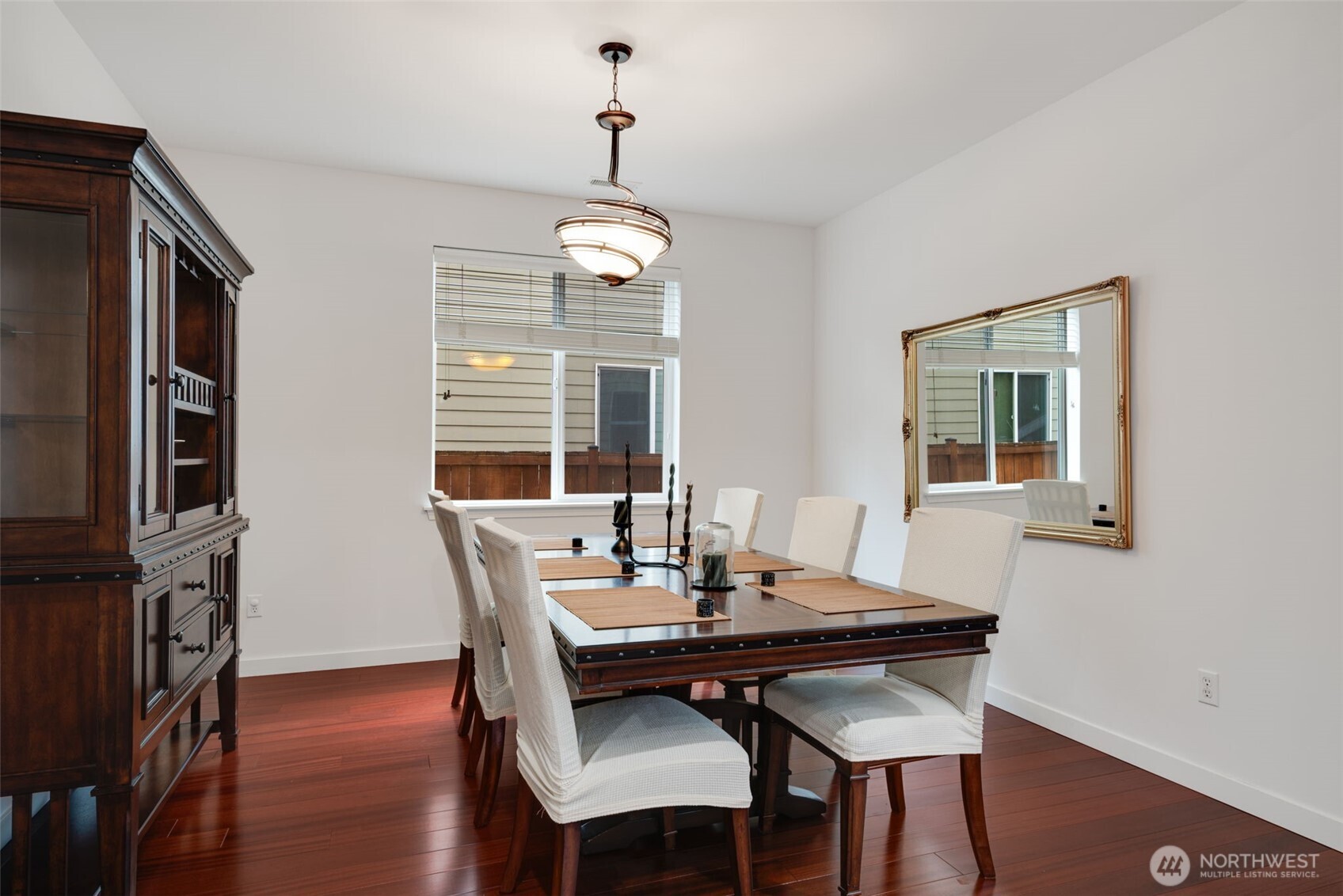 17026 Southeast 263rd Street Covington, WA 98042 - Photo 6 of 40 a view of a dining room with furniture window and wooden floor