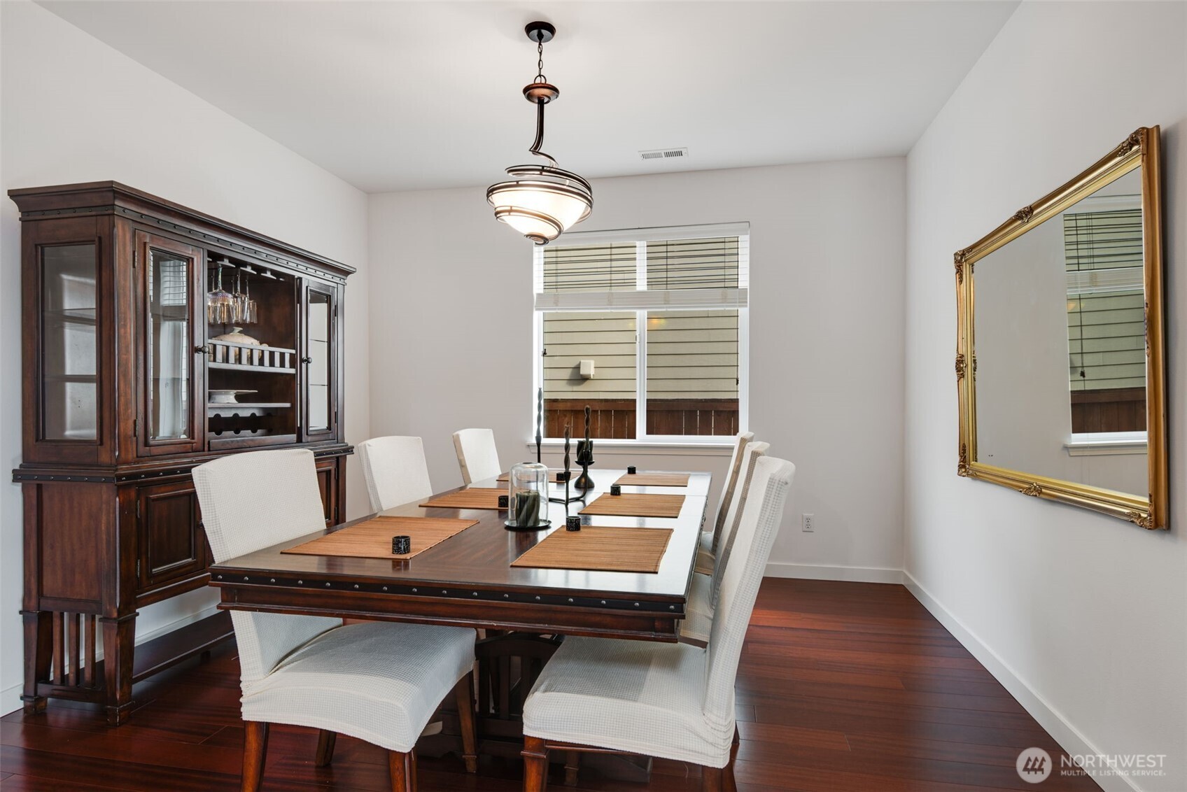 17026 Southeast 263rd Street Covington, WA 98042 - Photo 7 of 40 a view of a dining room with furniture window and wooden floor
