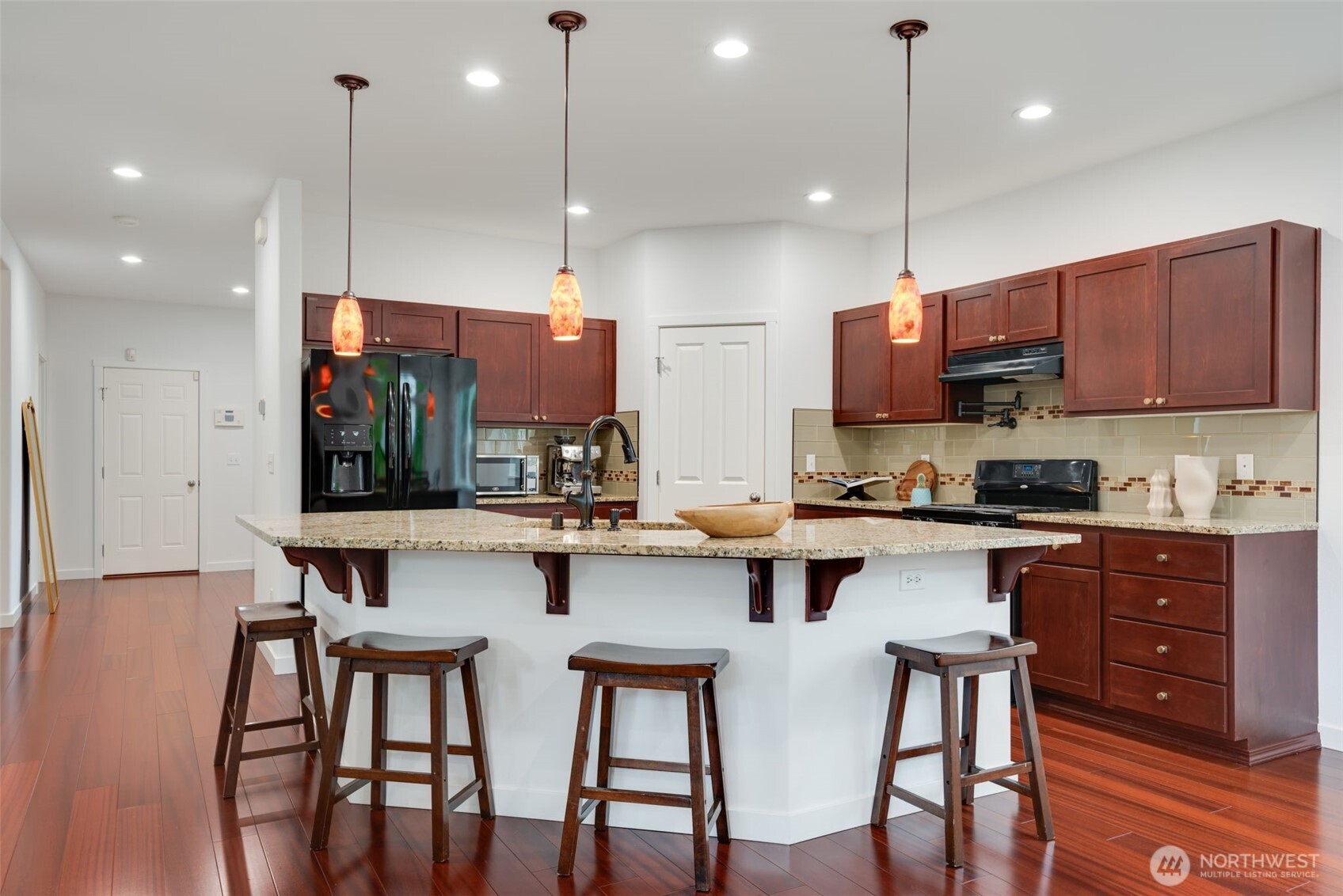 17026 Southeast 263rd Street Covington, WA 98042 - Photo 10 of 40 a kitchen with lots of counter space and appliances