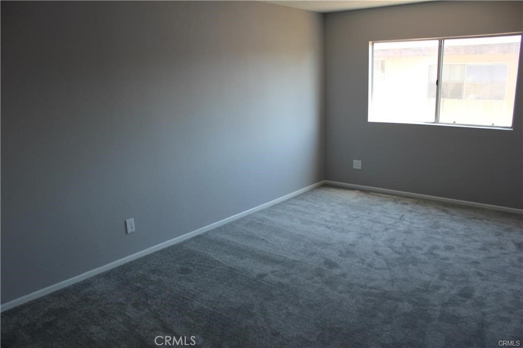 9734 Maple Street Bellflower, CA 90706 - Photo 5 of 11 an empty room with a window