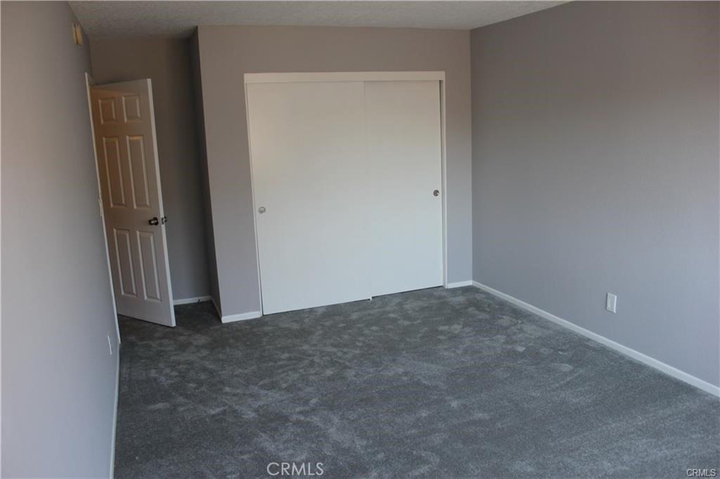 9734 Maple Street Bellflower, CA 90706 - Photo 6 of 11 an empty room with a door