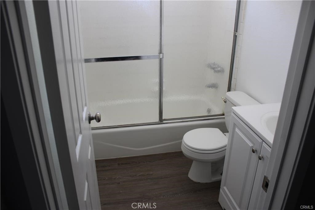 9734 Maple Street Bellflower, CA 90706 - Photo 7 of 11 a bathroom with a toilet and a shower
