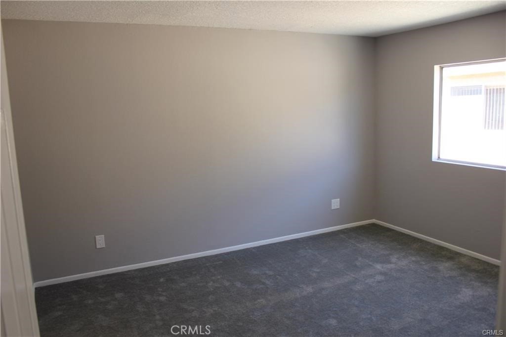 9734 Maple Street Bellflower, CA 90706 - Photo 8 of 11 an empty room with a window