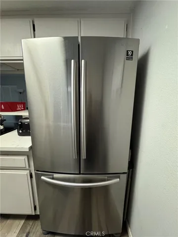 a view of a refrigerator in kitchen