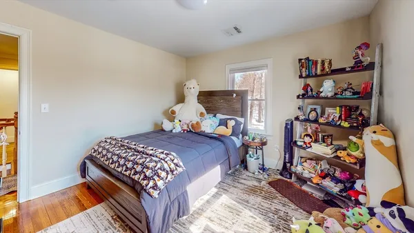 a bed room with a bed and a window