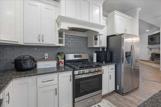 a bedroom with a bed and a ceiling fan