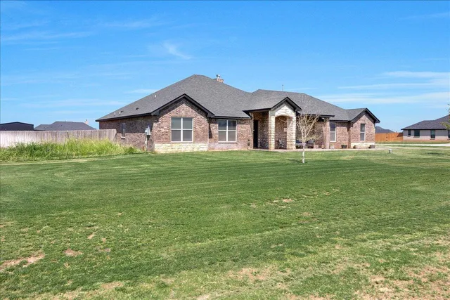a big house with a big yard and more windows