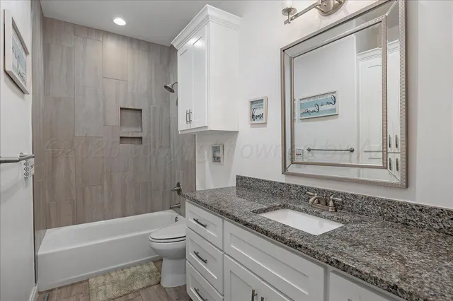 a bedroom with a bed and a cabinets