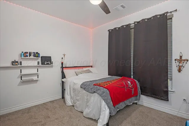 a bathroom with a granite countertop sink a toilet and bathtub