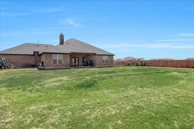 a view of a field with an ocean view