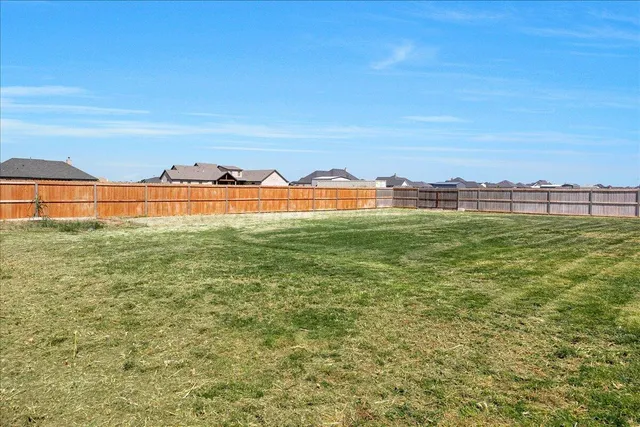 a view of a swimming pool and lounge chair