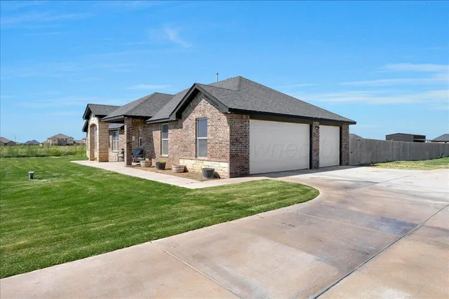 a brick building with a bench in front of it