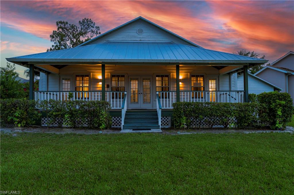 3988 Reflection Court Naples, FL 34109 - Photo 38 of 50 Back of Home with Virtual Landscape Lighting