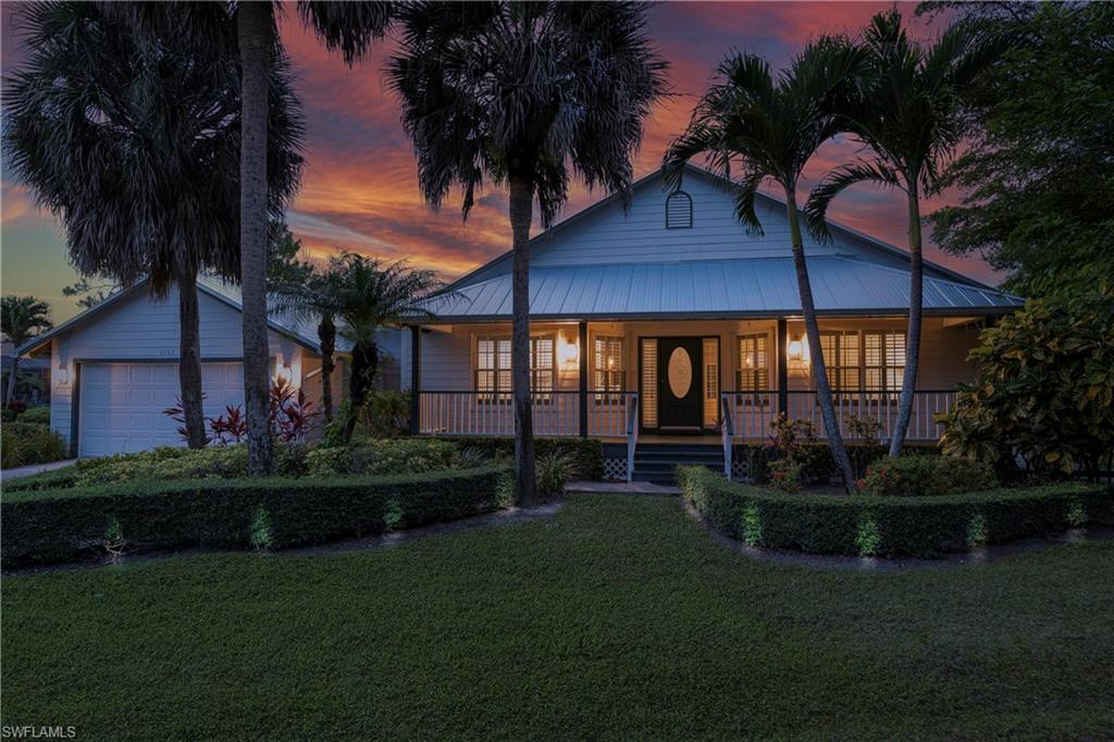 3988 Reflection Court Naples, FL 34109 - Photo 6 of 50 Front of Home with Virtual Landscape Lighting