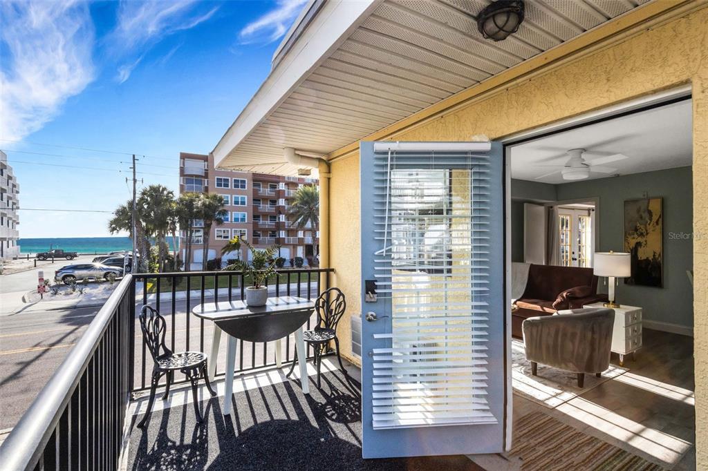 16333 Gulf Boulevard, Unit 215 Redington Beach, FL 33708 - Photo 1 of 38 a view of a chairs and table in the balcony