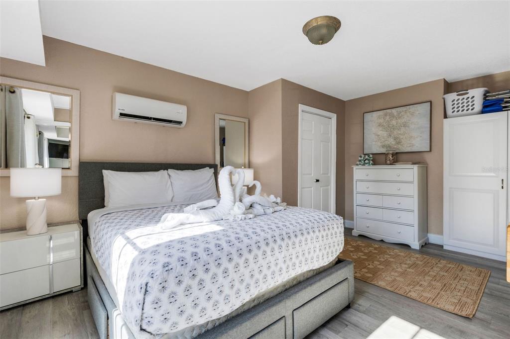 16333 Gulf Boulevard, Unit 215 Redington Beach, FL 33708 - Photo 18 of 38 a bedroom with a bed and cabinets