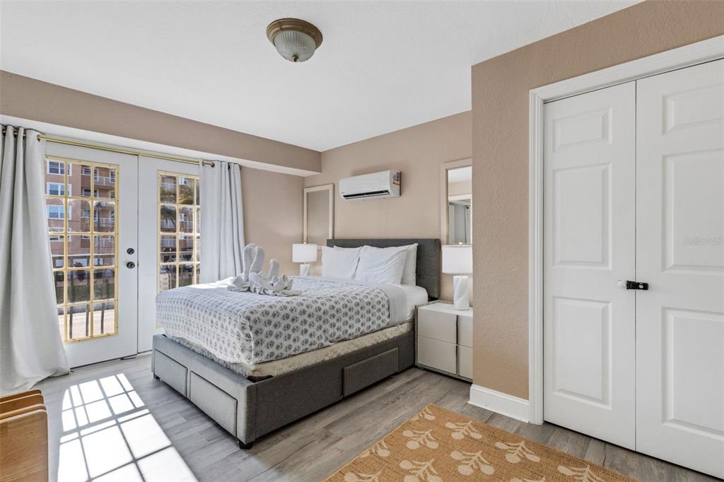 16333 Gulf Boulevard, Unit 215 Redington Beach, FL 33708 - Photo 20 of 38 a bed room with a bed and a window