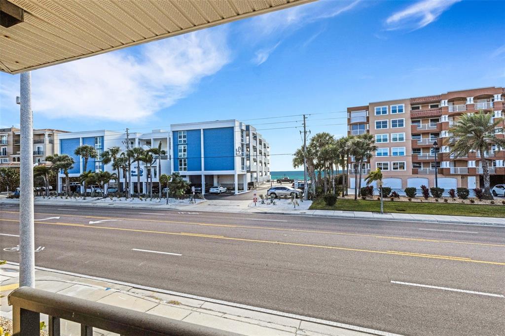 16333 Gulf Boulevard, Unit 215 Redington Beach, FL 33708 - Photo 26 of 38 a building exterior with stairs and windows