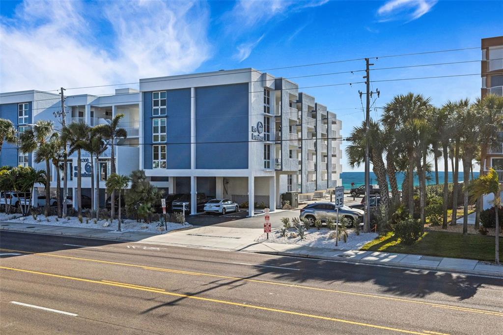 16333 Gulf Boulevard, Unit 215 Redington Beach, FL 33708 - Photo 27 of 38 a front view of a building with street view