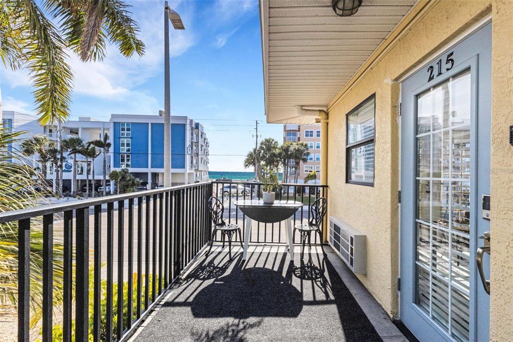 16333 Gulf Boulevard, Unit 215 Redington Beach, FL 33708 - Photo 29 of 38 a view of a balcony with a potted plant and iron fence