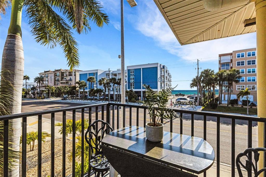 16333 Gulf Boulevard, Unit 215 Redington Beach, FL 33708 - Photo 30 of 38 a view of a balcony with wooden chairs