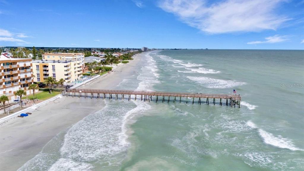 16333 Gulf Boulevard, Unit 215 Redington Beach, FL 33708 - Photo 3 of 38 a view of a water with boats and trees in the background