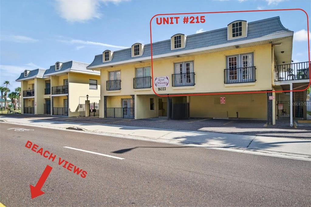 16333 Gulf Boulevard, Unit 215 Redington Beach, FL 33708 - Photo 34 of 38 a front view of a building with retail shops