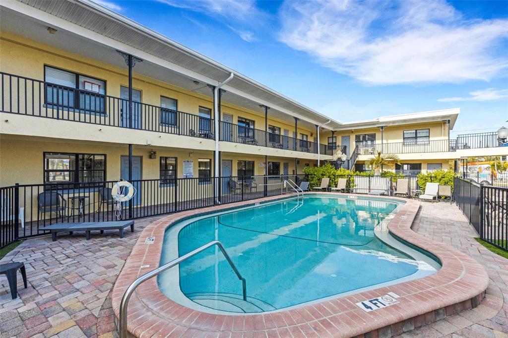 16333 Gulf Boulevard, Unit 215 Redington Beach, FL 33708 - Photo 5 of 38 a view of a house with swimming pool