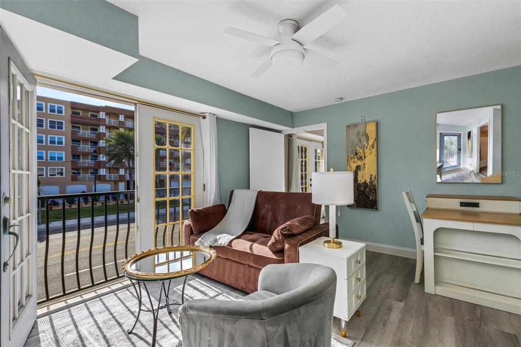 16333 Gulf Boulevard, Unit 215 Redington Beach, FL 33708 - Photo 6 of 38 a living room with furniture and a window