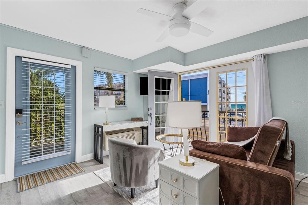 16333 Gulf Boulevard, Unit 215 Redington Beach, FL 33708 - Photo 9 of 38 a living room with furniture and a window