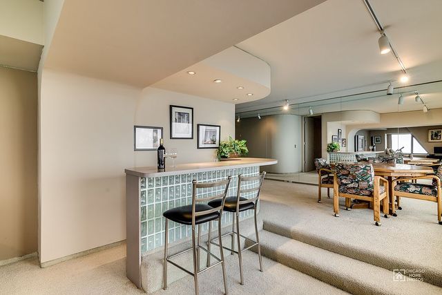 175 East Delaware Place, Unit 5609 Chicago, IL 60611 - Photo 12 of 28 a view of a dining room with furniture