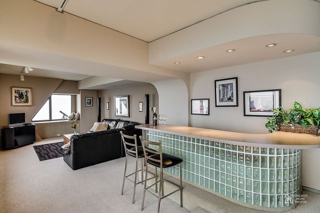 175 East Delaware Place, Unit 5609 Chicago, IL 60611 - Photo 13 of 28 a bedroom with furniture and a window