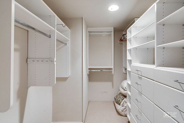 175 East Delaware Place, Unit 5609 Chicago, IL 60611 - Photo 18 of 28 a view of storage and utility room with washer and dryer
