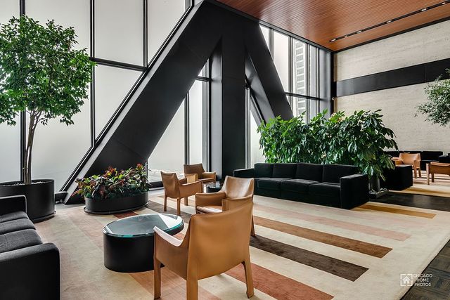 175 East Delaware Place, Unit 5609 Chicago, IL 60611 - Photo 21 of 28 a view of a chairs and table in the balcony