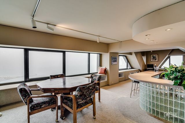 175 East Delaware Place, Unit 5609 Chicago, IL 60611 - Photo 10 of 28 a outdoor dining space with furniture and window