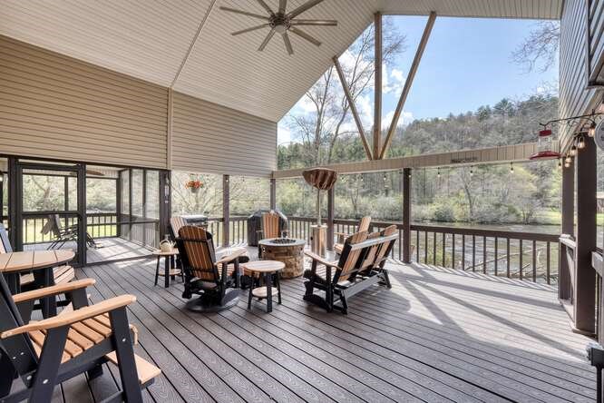 2121 Die Bend Road Murphy, NC 28906 - Photo 14 of 47 a view of a patio with table and chairs and wooden floor