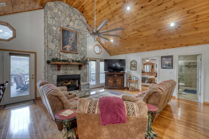 2121 Die Bend Road Murphy, NC 28906 - Photo 23 of 47 a living room with furniture a fireplace and a flat screen tv