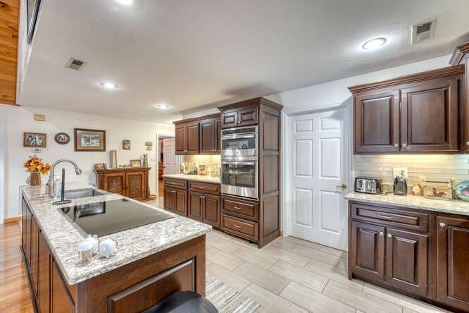 2121 Die Bend Road Murphy, NC 28906 - Photo 26 of 47 a kitchen with stainless steel appliances granite countertop a sink dishwasher stove and refrigerator