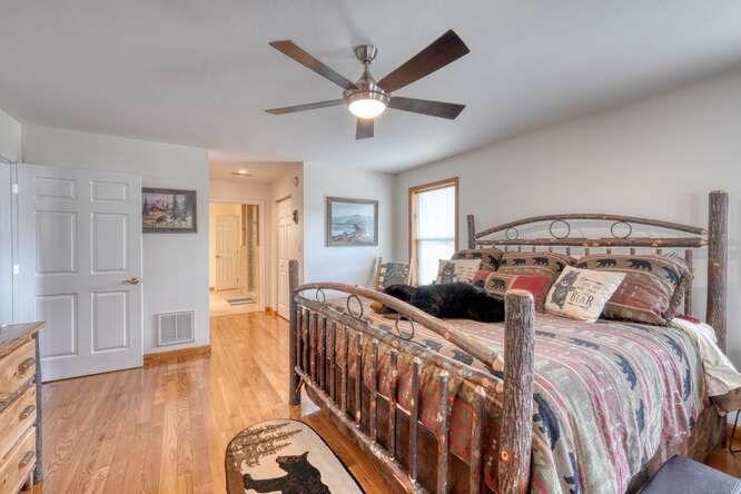 2121 Die Bend Road Murphy, NC 28906 - Photo 33 of 47 a bedroom with a bed and wooden floor