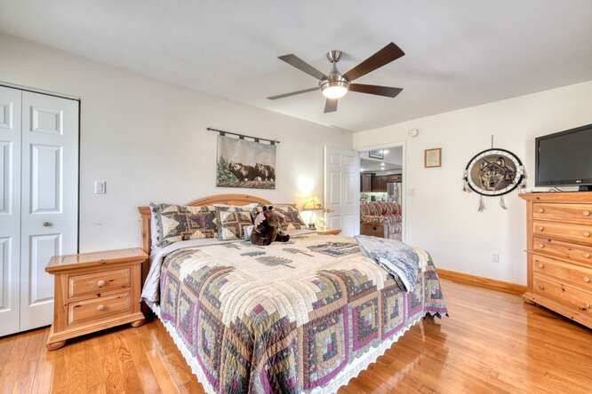 2121 Die Bend Road Murphy, NC 28906 - Photo 40 of 47 a bedroom with a bed and a chandelier