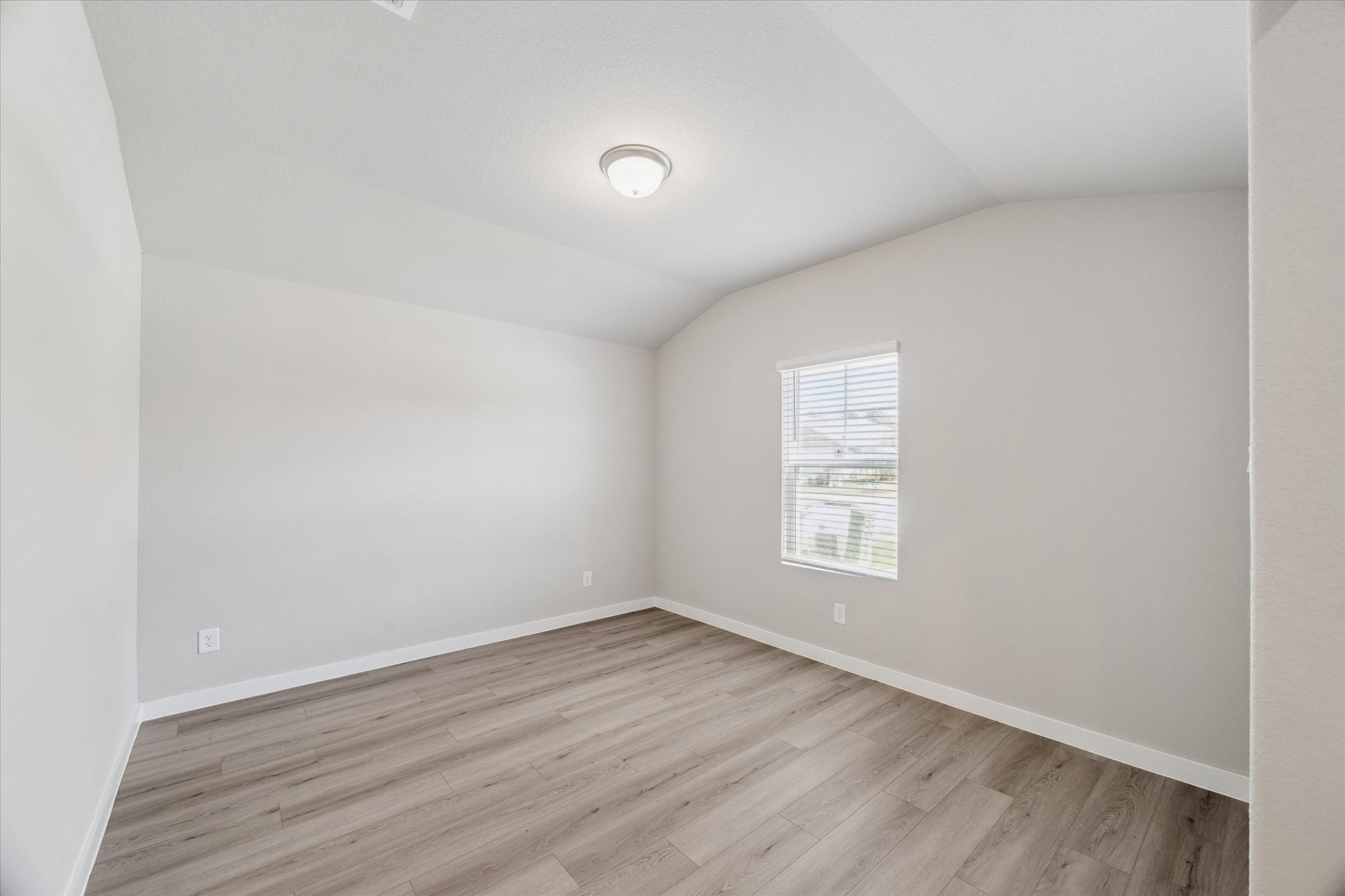 1510 King Rnch Road Conroe, TX 77301 - Photo 12 of 18 an empty room with wooden floor and windows