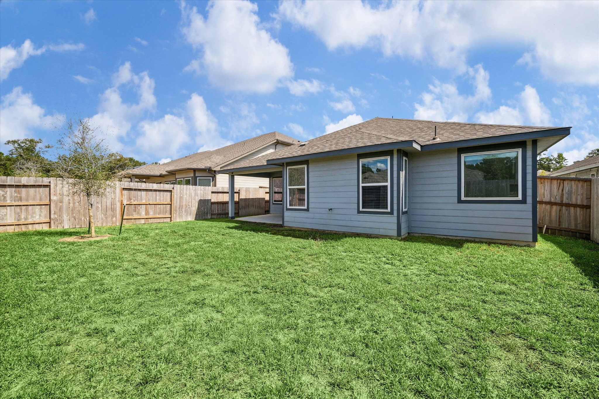 1510 King Rnch Road Conroe, TX 77301 - Photo 18 of 18 a view of a house with a back yard