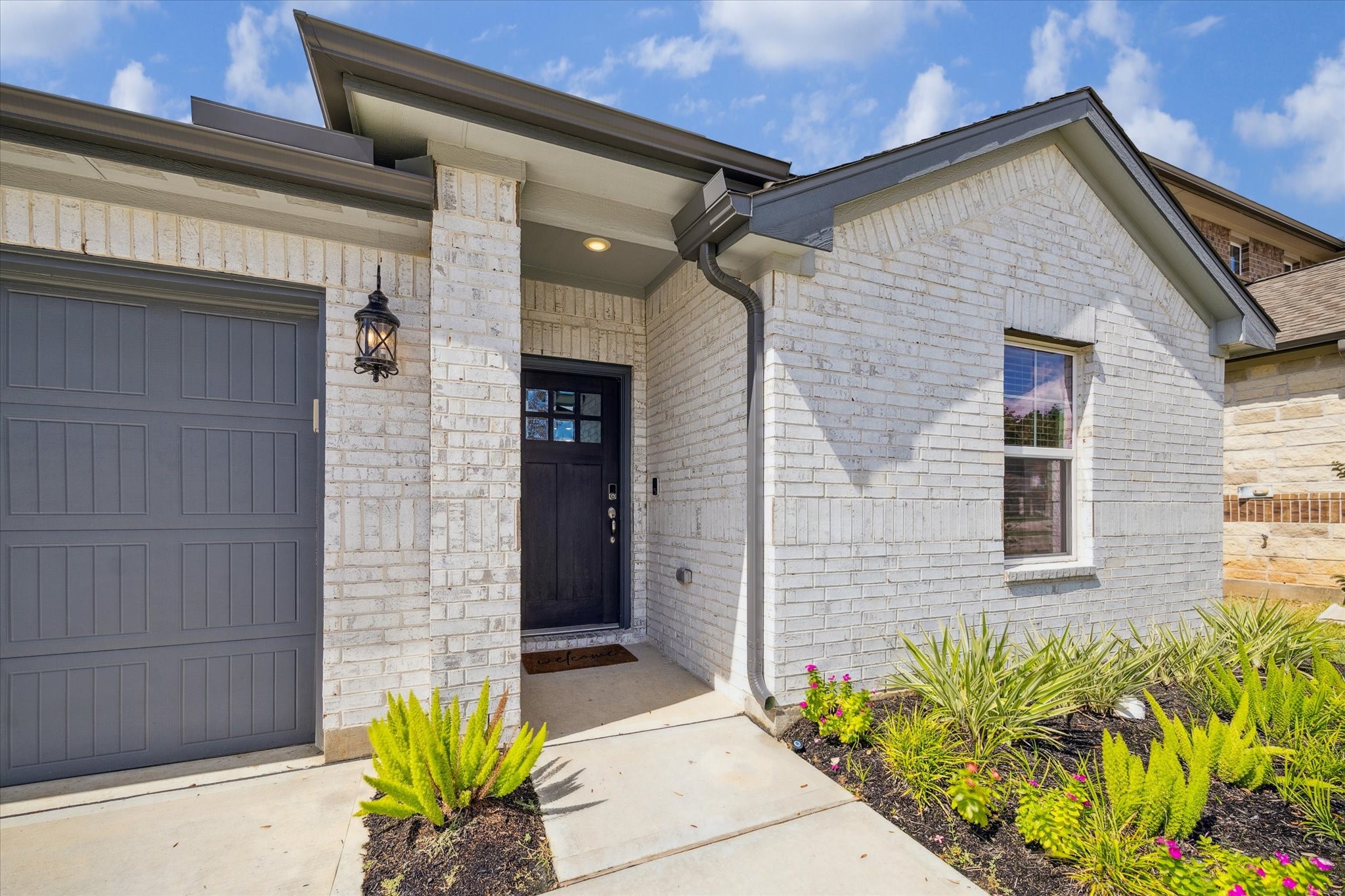 1510 King Rnch Road Conroe, TX 77301 - Photo 2 of 18 a front view of a house with a blue gate