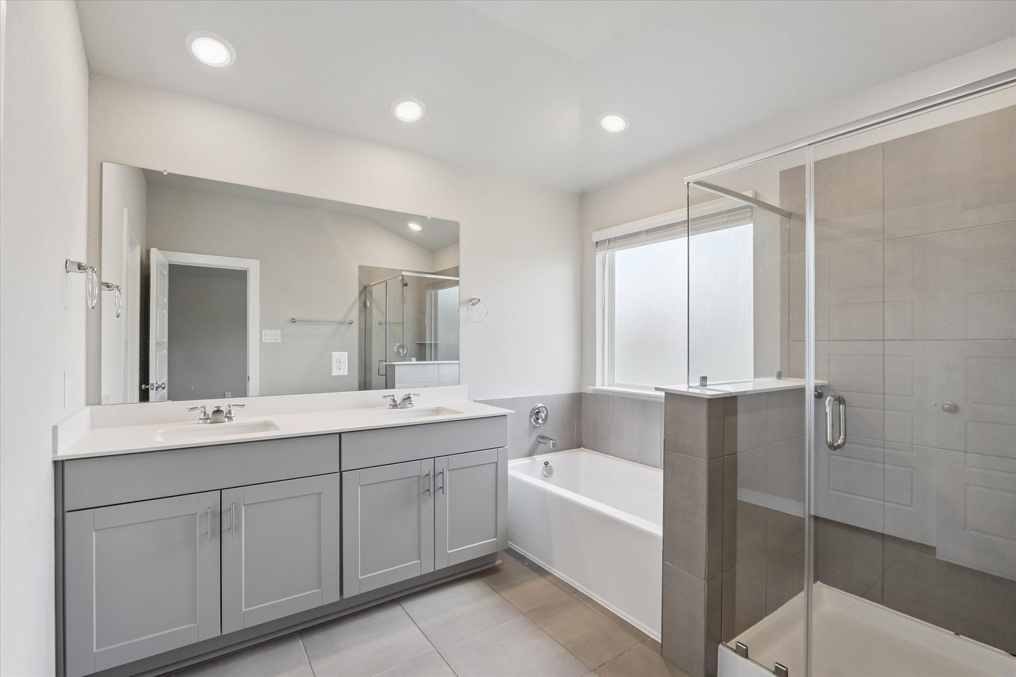 1510 King Rnch Road Conroe, TX 77301 - Photo 10 of 18 a bathroom with a tub sink shower and mirror