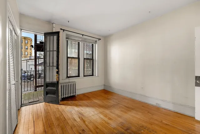 a view of an empty room with glass door